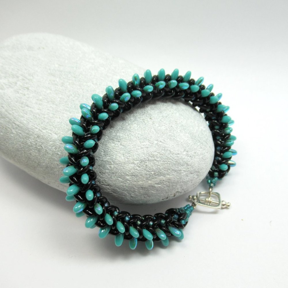 Handwoven teal and black bracelet